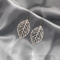 Shangjie OEM Anillo Retro hollow metal leaves gold stud earing trendy earrings 2021 exaggerated earrings